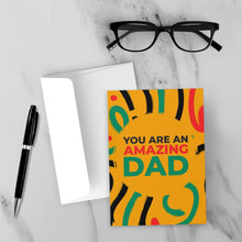 Load image into Gallery viewer, Colors of Africa Festive - Amazing Dad - Black Card Shop (Yellow) Front with Sample Background