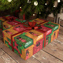 Load image into Gallery viewer, African American Christmas Doll Gift Wrapping Paper Roll (Variety of Hairstyles) under Christmas tree.