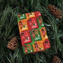 Load image into Gallery viewer, African American Christmas Doll Gift Wrapping Paper Roll (Variety of Hairstyles | A) on a green leafy background
