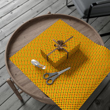 Load image into Gallery viewer, Colors of Africa Hearts Gift Wrapping Paper Roll (Main Color Yellow) Yellow gift wrap with a box and scissors on a wooden tray outdoors.