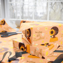 Load image into Gallery viewer, Sending You Pure Sunshine - African American Woman - Yellow Gift Wrapping Paper - Afro Hair Gift boxes with sunflower-themed wrapping paper on a table with scissors.